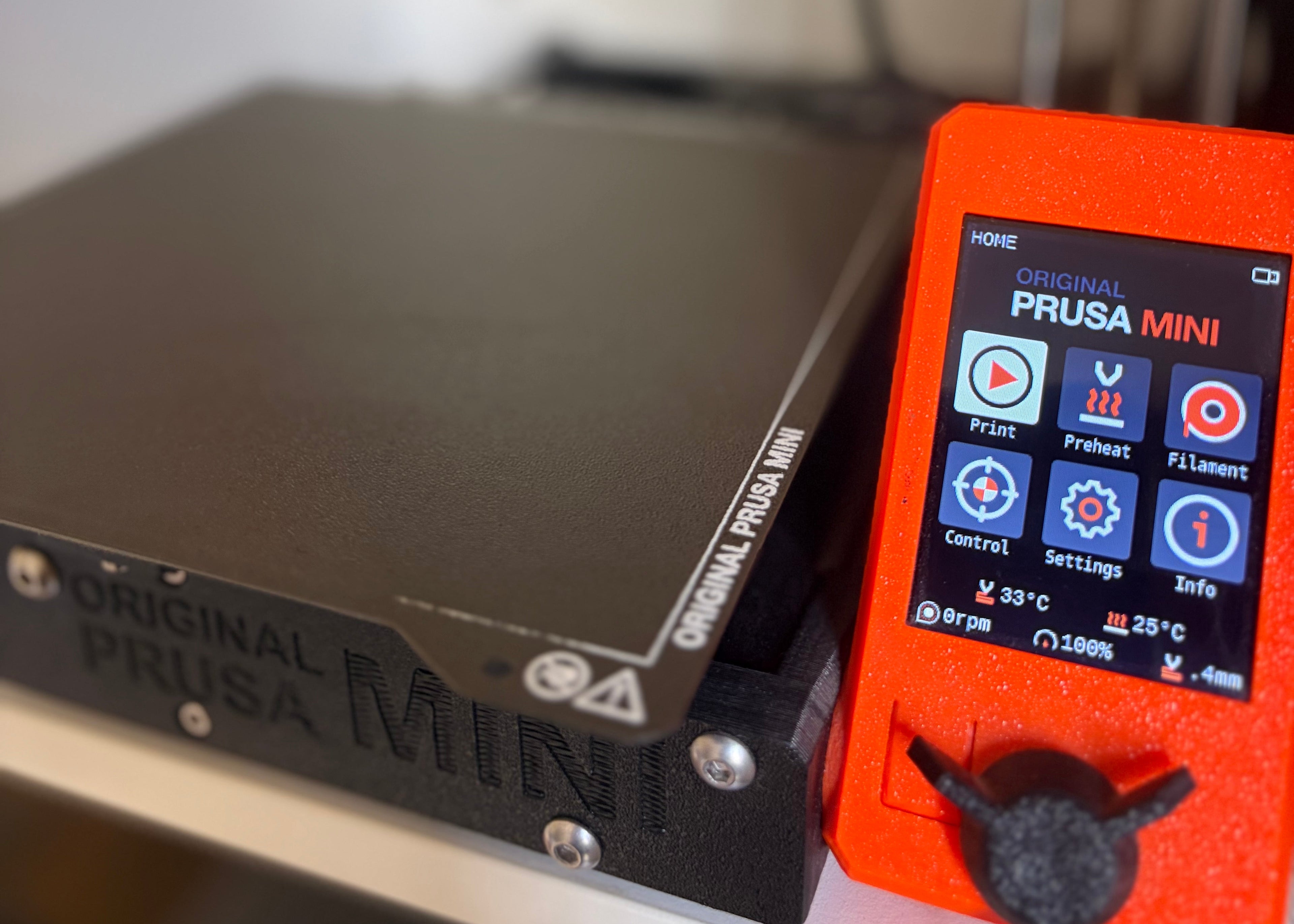 3D printer with Prusa Mini control panel on a white background